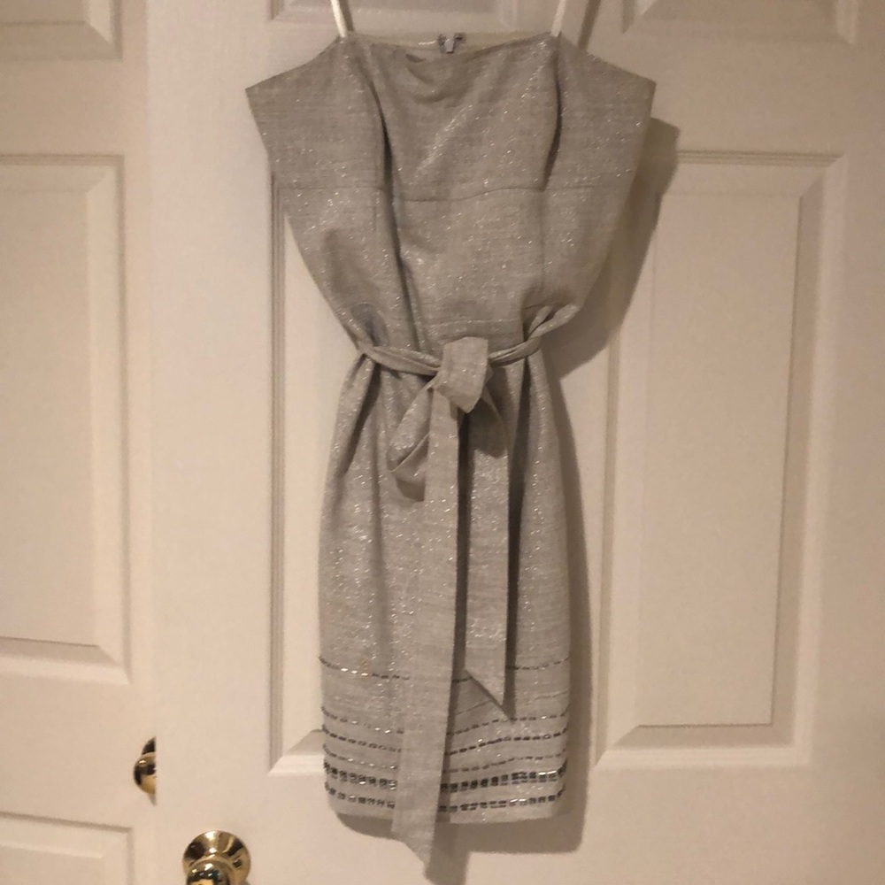 Strapless light khaki dress; beaded hemline